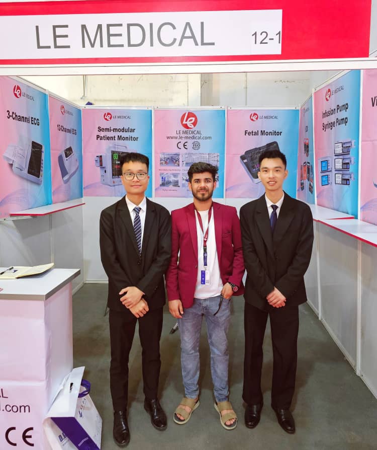 Patient monitoring and cardiology equipment display at an international medical trade show.